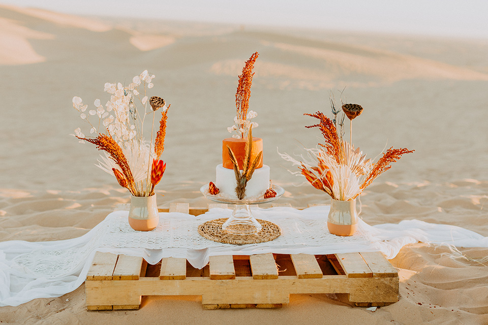  glamis sand dunes wedding with the groom in a tan and a gold velvet tuxedo at sunset – couple at ceremony