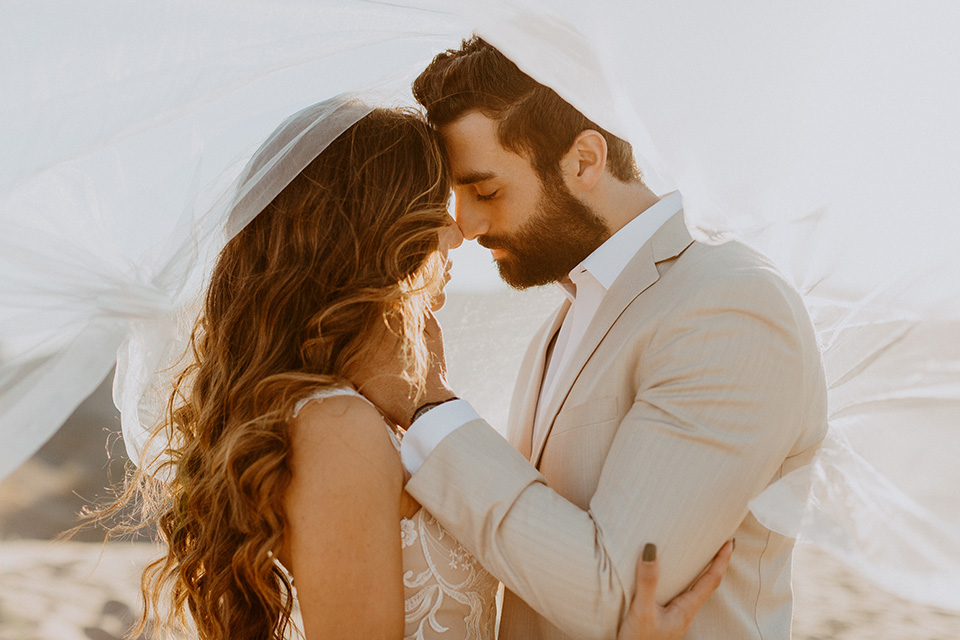  glamis sand dunes wedding with the groom in a tan and a gold velvet tuxedo at sunset – couple at ceremony