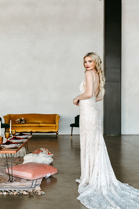  tropical metallic wedding with the bride in an ivory lace gown and the groom in a green suit 