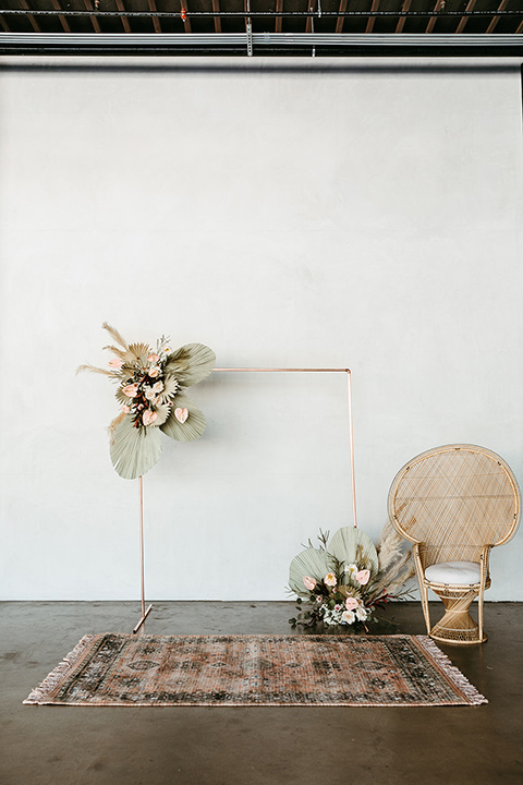  tropical metallic wedding with the bride in an ivory lace gown and the groom in a green suit 