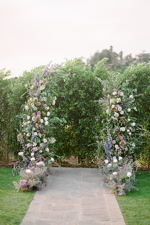 hilltop garden wedding with springtime details – ceremony arch