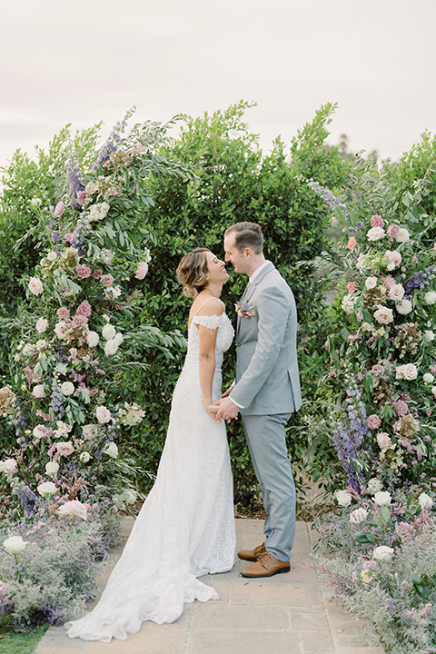  hilltop garden wedding with springtime details – couple at ceremony 