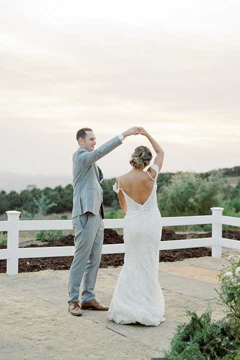  hilltop garden wedding with springtime details – couple dancing 