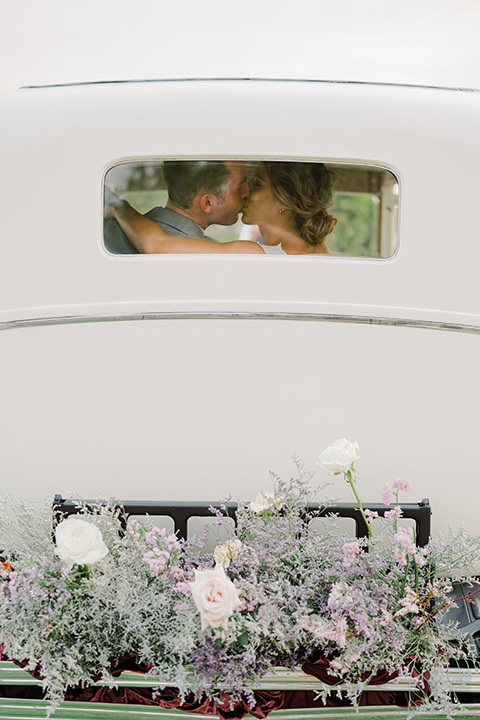  hilltop garden wedding with springtime details – in the car 
