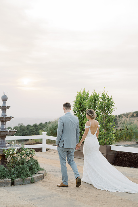  hilltop garden wedding with springtime details – couple walking