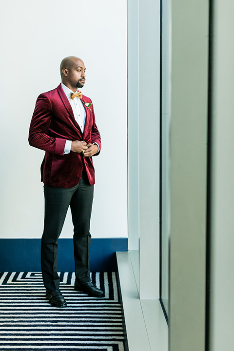  glitz and glam shoot at the Hotel Indigo – groom style in a burgundy velvet tuxedo