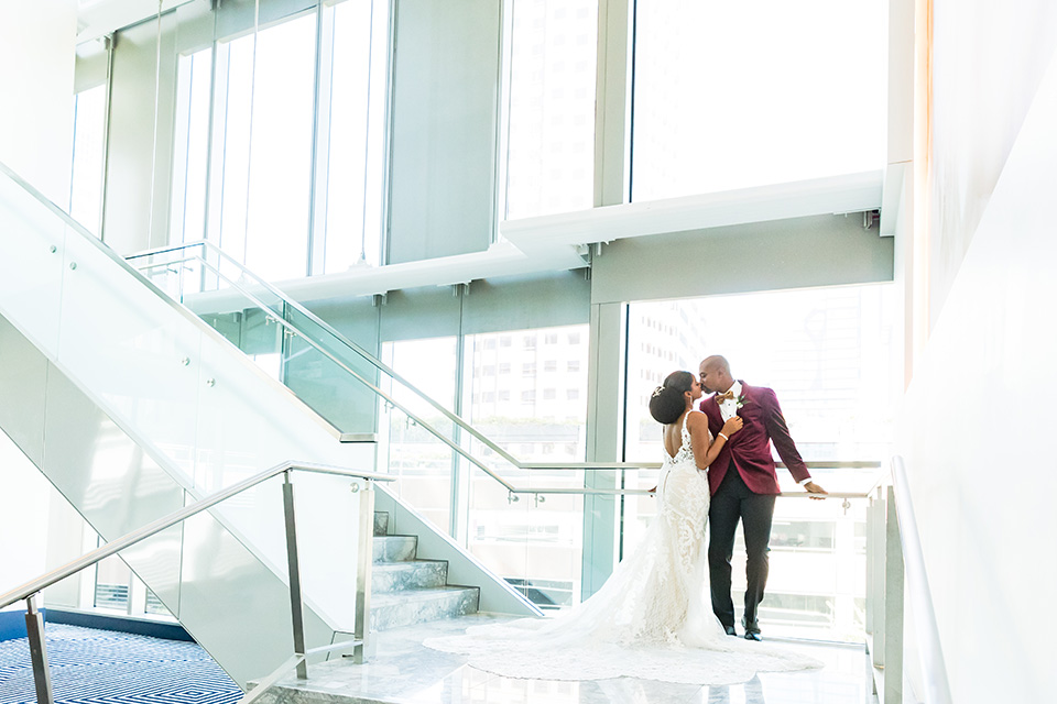  glitz and glam shoot at the Hotel Indigo – couple by the stairs 2 