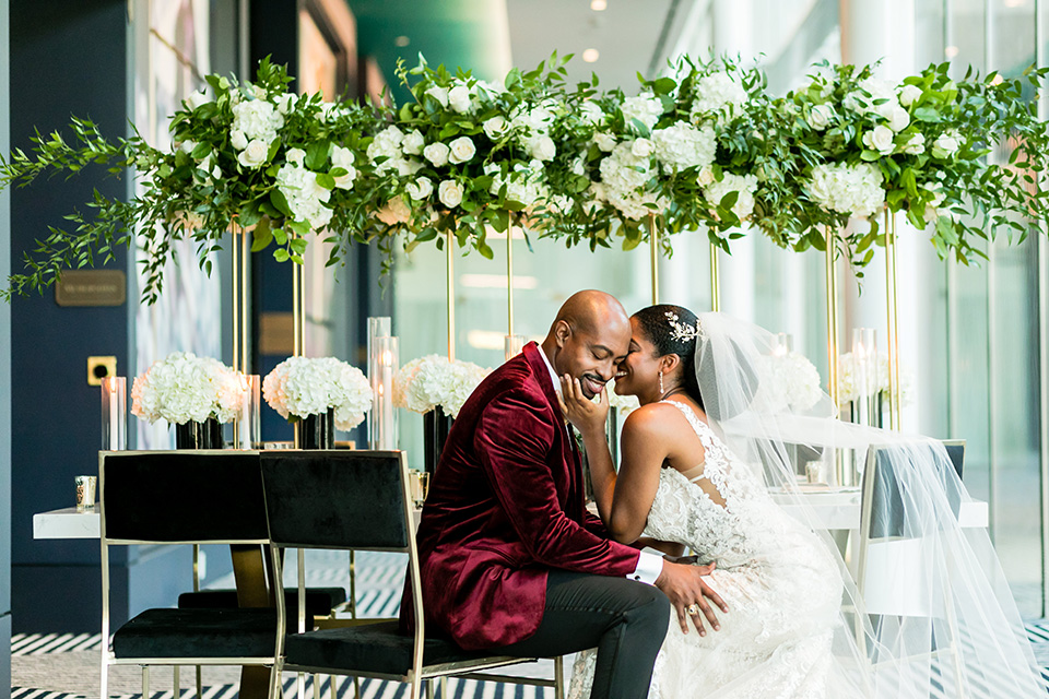  glitz and glam shoot at the Hotel Indigo – couple sitting at the table 