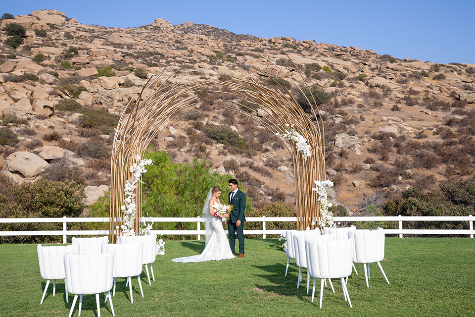  bright colorful wedding with the groom in a green velvet tuxedo - ceremony 