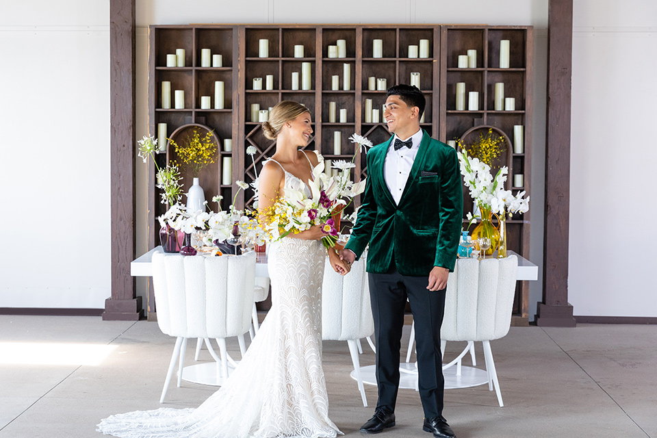  bright colorful wedding with the groom in a green velvet tuxedo – couple at reception 