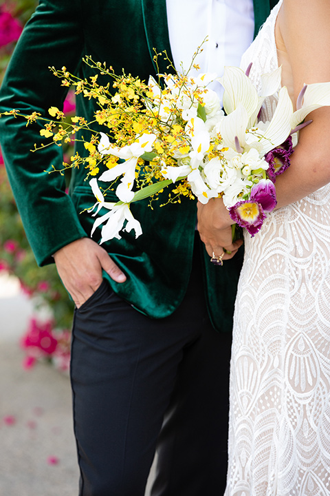  bright colorful wedding with the groom in a green velvet tuxedo - bride 