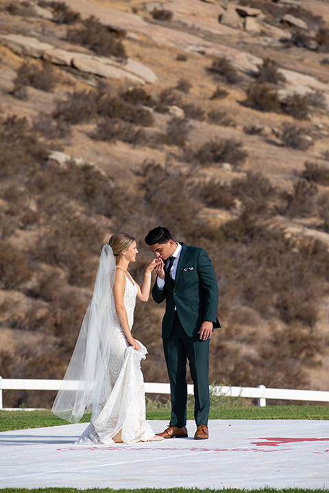  bright colorful wedding with the groom in a green velvet tuxedo - bride 