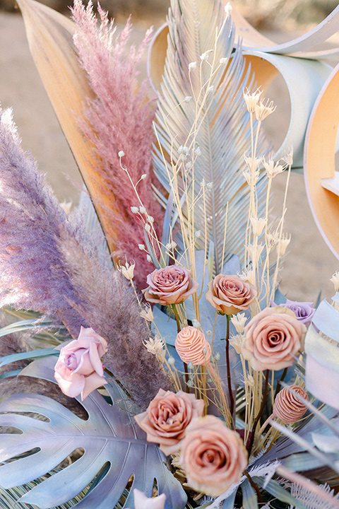  Iridescent dreams in the desert with the bride in a pink dress and the groom in a rose suit - florals 