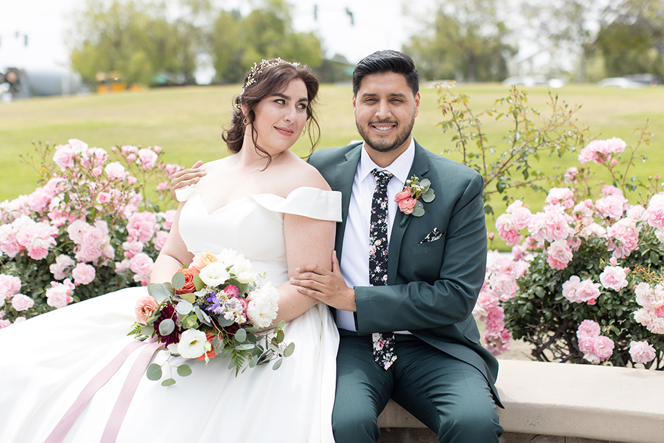  garden wedding with a green and pink color scheme – couple sitting 