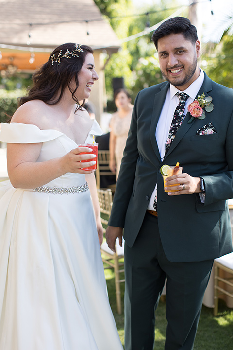  garden wedding with a green and pink color scheme – bride and groom drinking 