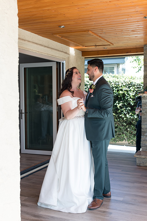  garden wedding with a green and pink color scheme – bride and groom dancing 