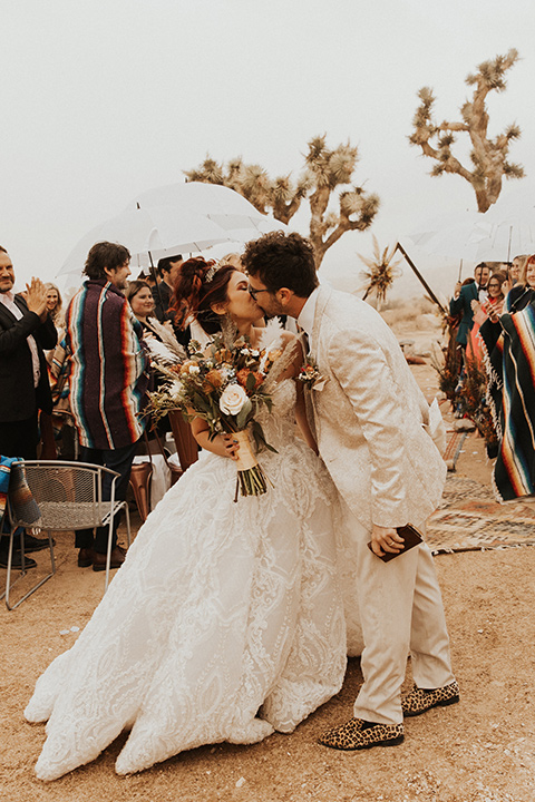  Jillian Rose Reed’s fabulous desert boho wedding – couple kissing