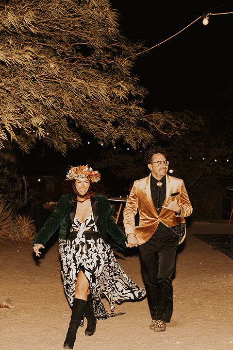  Jillian Rose Reed’s fabulous desert boho wedding – couple in second looks walking