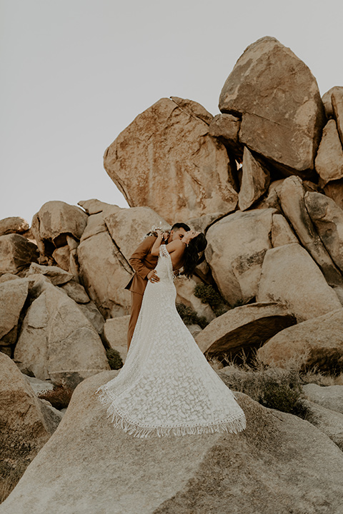  Joshua Tree elopement with boho style and the groom in a caramel brown suit 