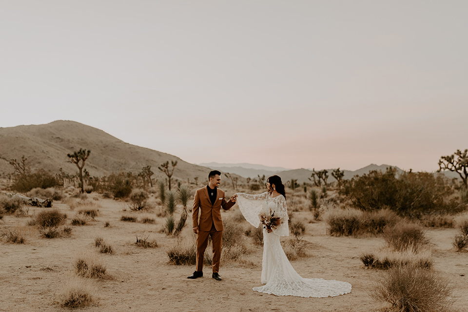  Joshua Tree elopement with boho style and the groom in a caramel brown suit 