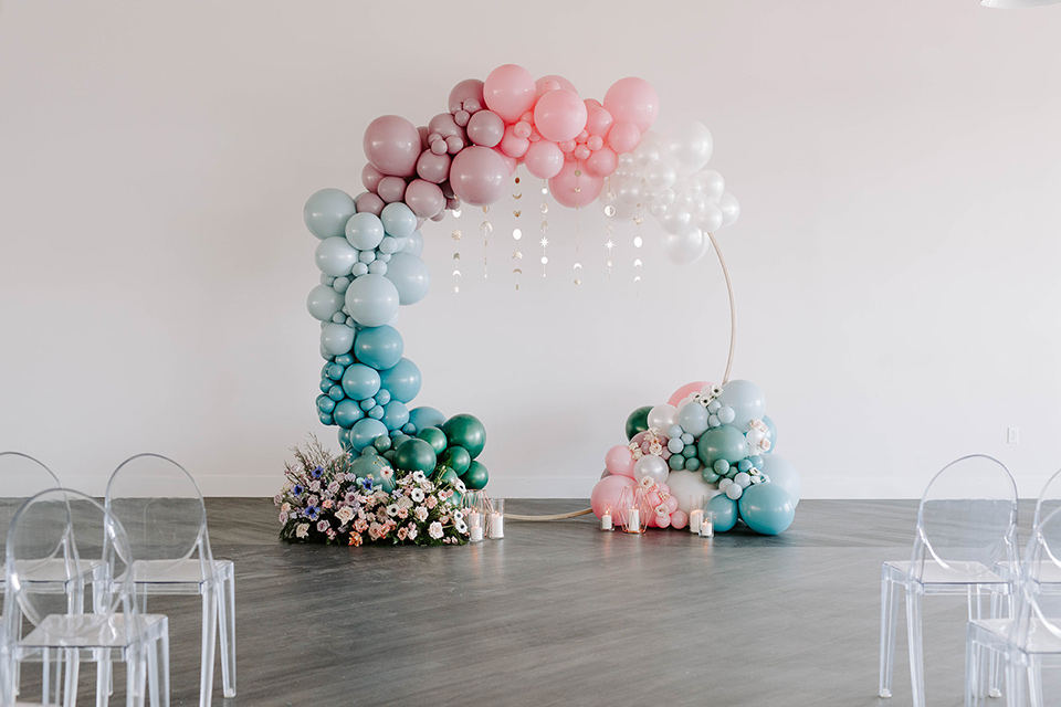  pastel and gold wedding with celestial décor – and the groom in a tan suit and a gold velvet tuxedo – balloon arch 