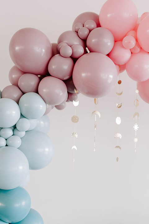  pastel and gold wedding with celestial décor – and the groom in a tan suit and a gold velvet tuxedo – balloon arch 