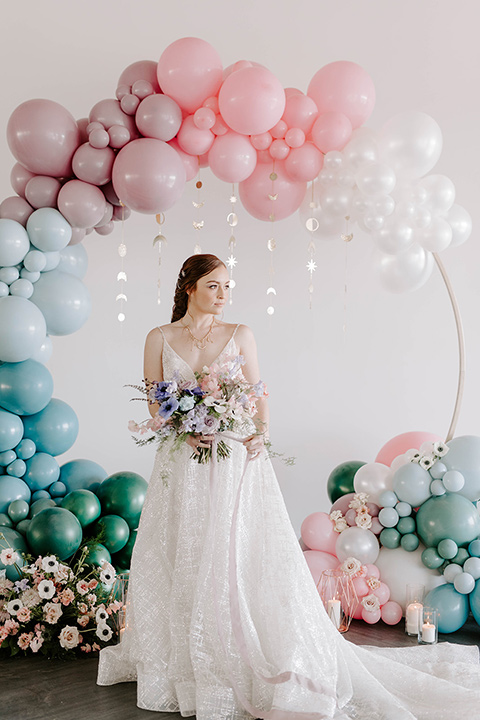  pastel and gold wedding with celestial décor – and the groom in a tan suit and a gold velvet tuxedo – bride 