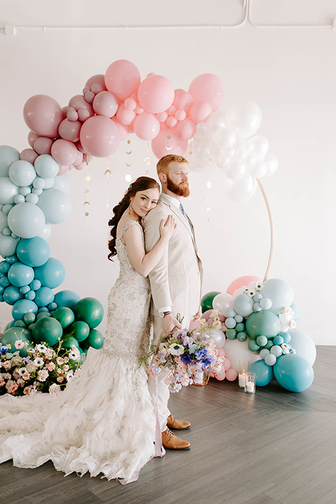  pastel and gold wedding with celestial décor – and the groom in a tan suit and a gold velvet tuxedo – ceremony tan 