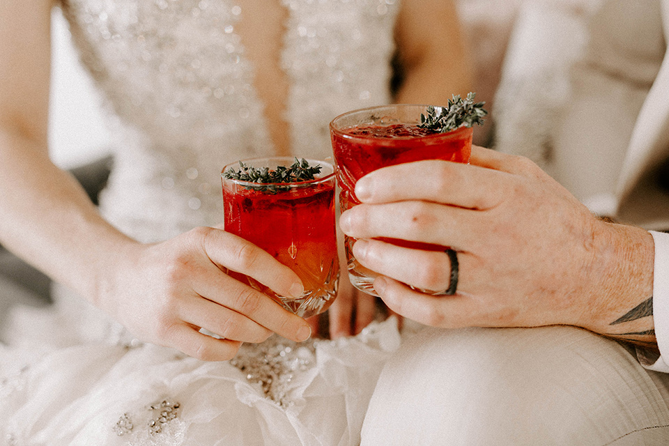  pastel and gold wedding with celestial décor – and the groom in a tan suit and a gold velvet tuxedo – cocktails 