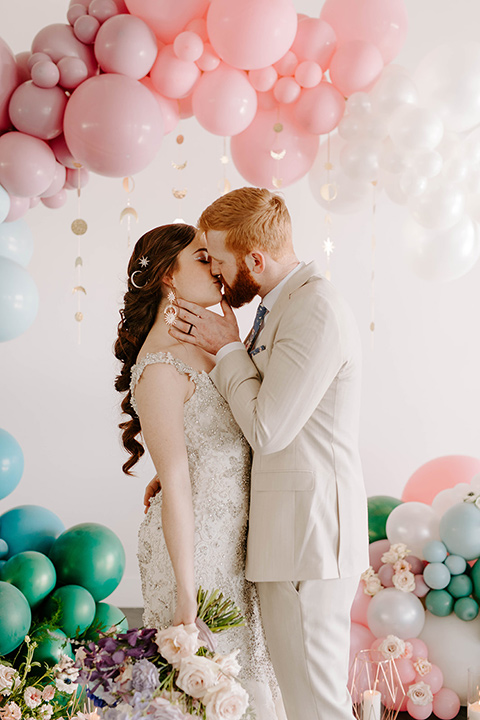  pastel and gold wedding with celestial décor – and the groom in a tan suit and a gold velvet tuxedo – ceremony tan 