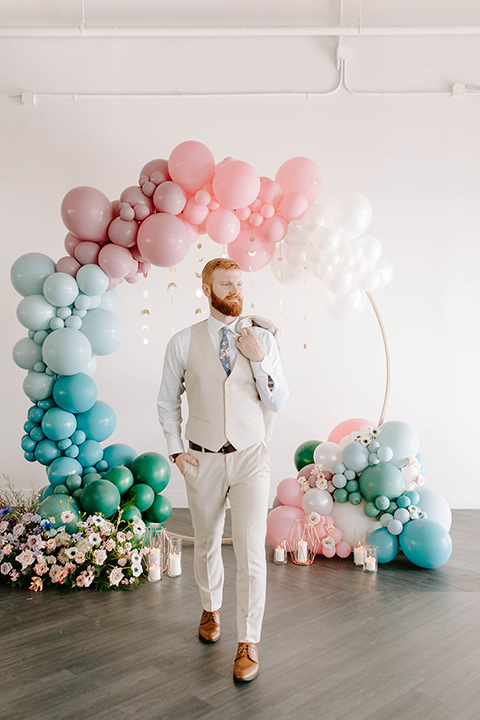  pastel and gold wedding with celestial décor – and the groom in a tan suit and a gold velvet tuxedo – groom 