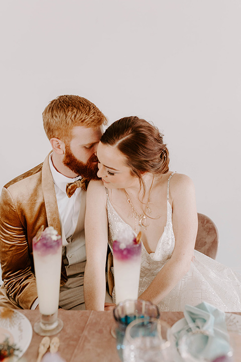  pastel and gold wedding with celestial décor – and the groom in a tan suit and a gold velvet tuxedo – groom 