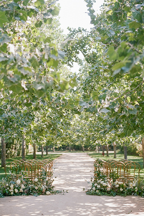  Kestrel Park wedding with the groom in a tan suit and the bride in an ivory wedding gown with a plunging neckline 