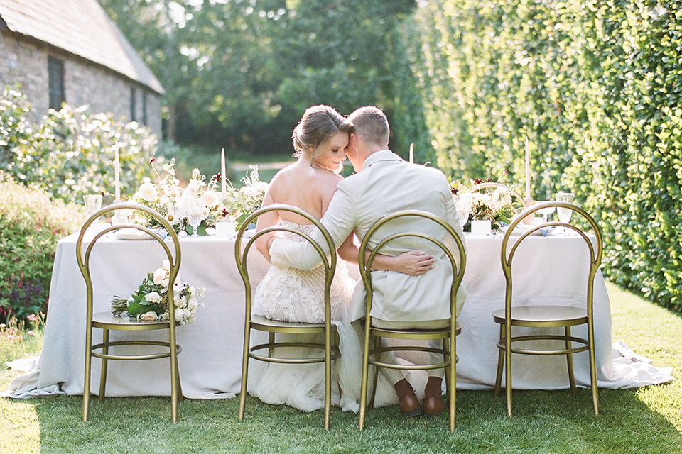  Kestrel Park wedding with the groom in a tan suit and the bride in an ivory wedding gown with a plunging neckline 