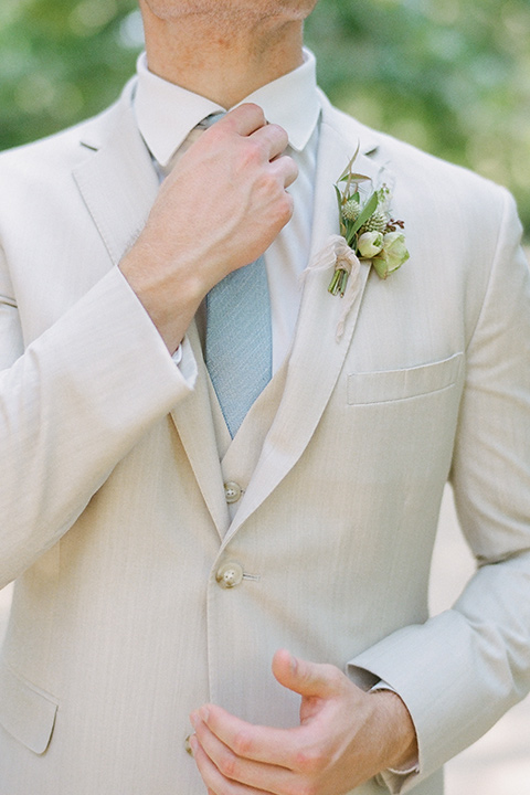  Kestrel Park wedding with the groom in a tan suit and the bride in an ivory wedding gown with a plunging neckline 