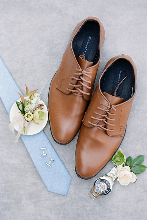  Kestrel Park wedding with the groom in a tan suit and the bride in an ivory wedding gown with a plunging neckline 