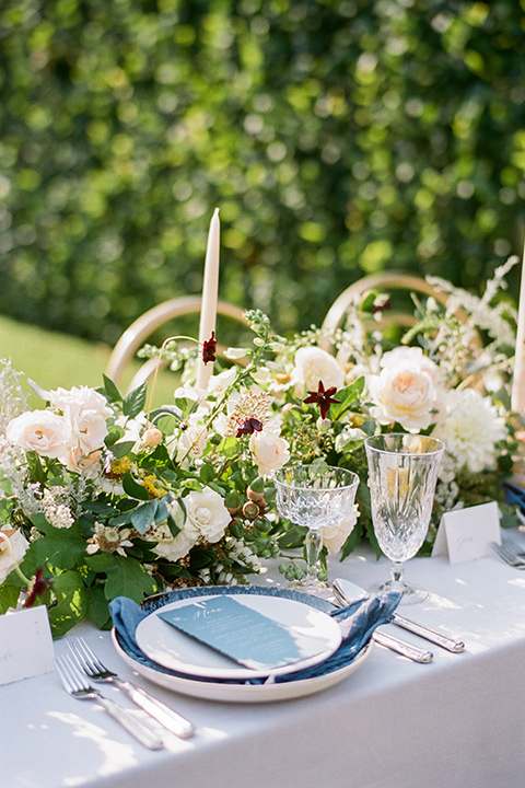  Kestrel Park wedding with the groom in a tan suit and the bride in an ivory wedding gown with a plunging neckline 