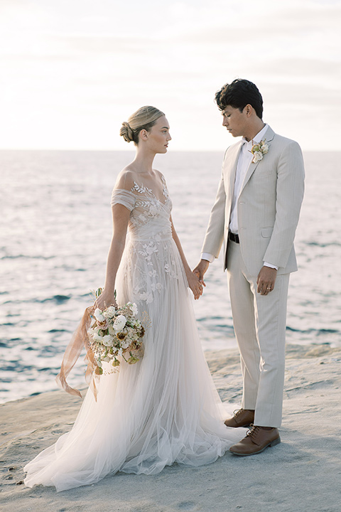  la jolla wedding on the beach with the groom in a tan suit – couple looking at the beach 