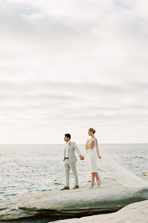  la jolla wedding on the beach with the groom in a tan suit – couple looking at the beach 