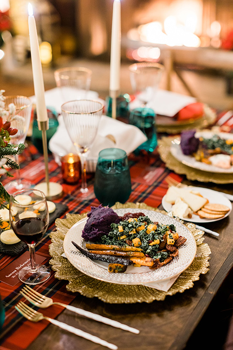  romantic winter inspired wedding theme with luxe textures and details, one groom wore a burgundy velvet shawl tuxedo and the other groom in a black paisley tuxedo – green gold and red table décor