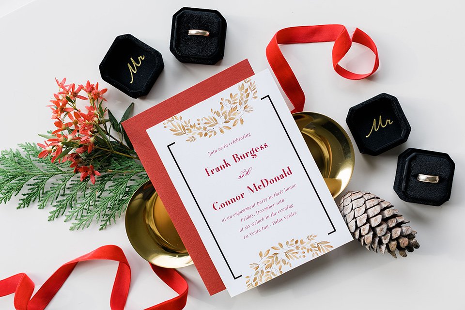  romantic winter inspired wedding theme with luxe textures and details, one groom wore a burgundy velvet shawl tuxedo and the other groom in a black paisley tuxedo – invitations