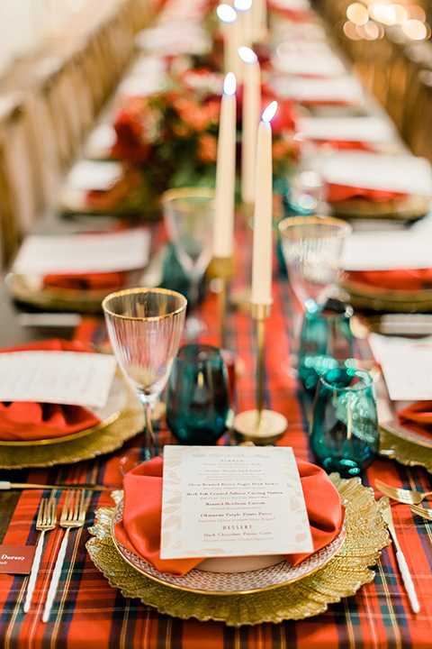  romantic winter inspired wedding theme with luxe textures and details, one groom wore a burgundy velvet shawl tuxedo and the other groom in a black paisley tuxedo – green gold and red table décor 