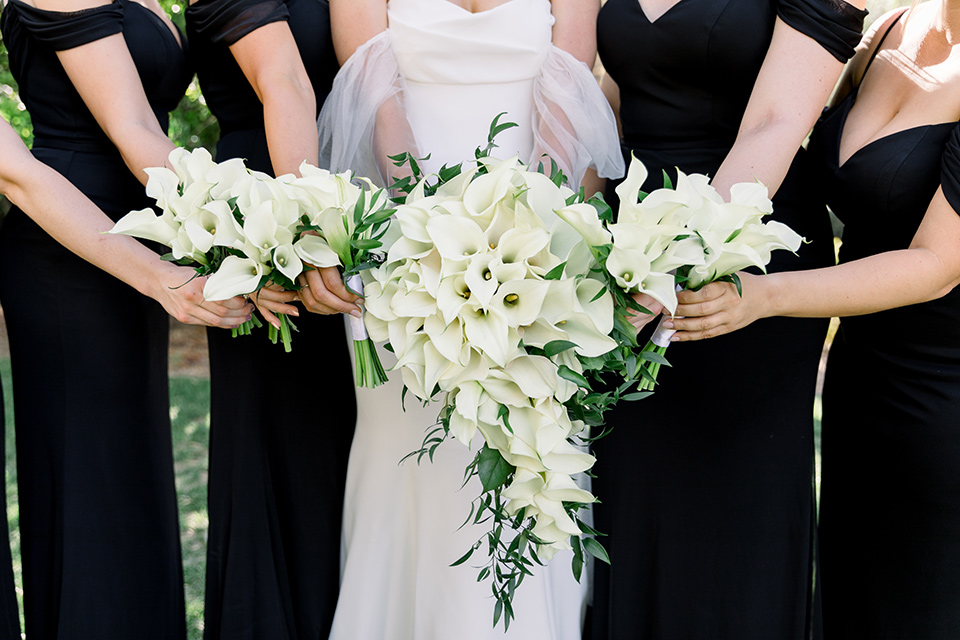  black and white wedding design with touches of greenery – bridesmaids floral arrangements 