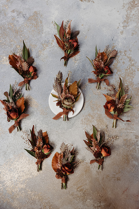  boho autumn wedding with the groom and groomsmen in a green suit – boutonnière
