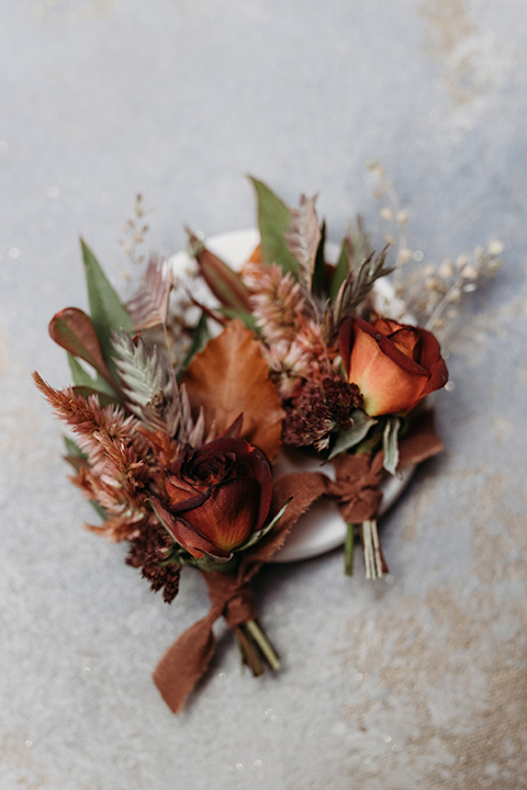  boho autumn wedding with the groom and groomsmen in a green suit – boutonnière 