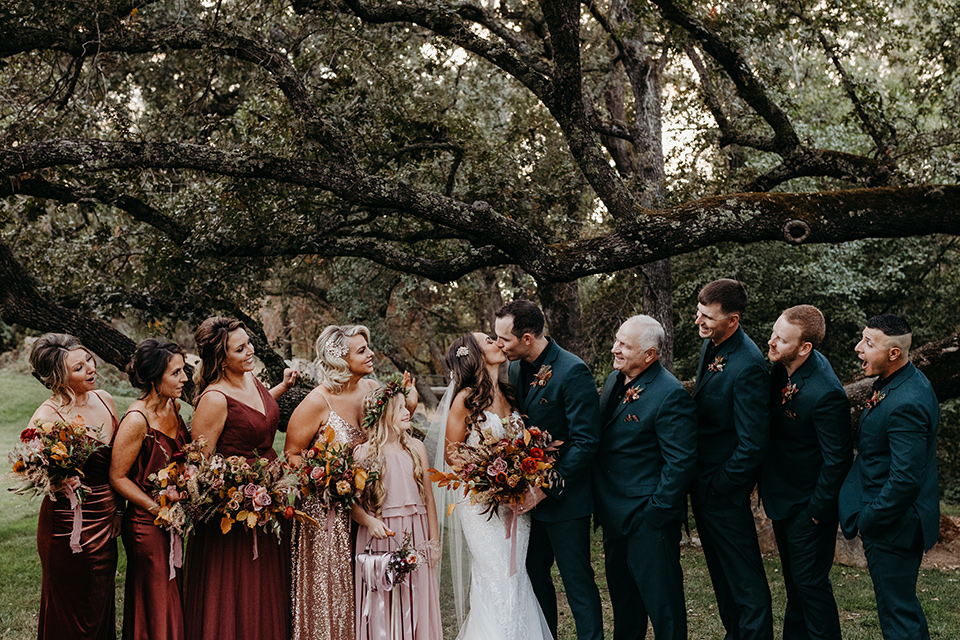  boho autumn wedding with the groom and groomsmen in a green suit – bridal party