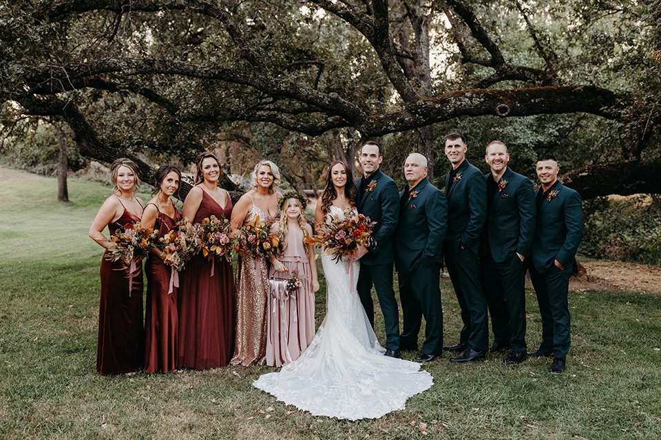  boho autumn wedding with the groom and groomsmen in a green suit – bridal party