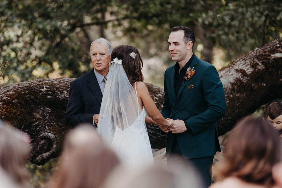  boho autumn wedding with the groom and groomsmen in a green suit –ceremony