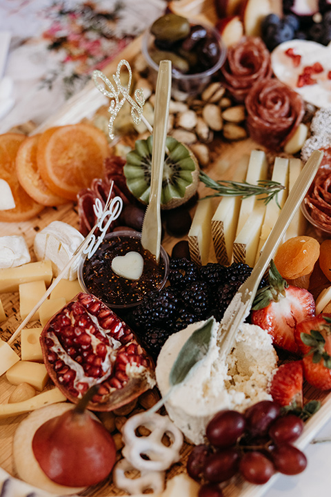  boho autumn wedding with the groom and groomsmen in a green suit – cheese platter 