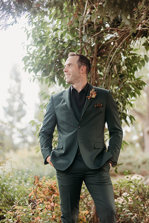  boho autumn wedding with the groom and groomsmen in a green suit – groom